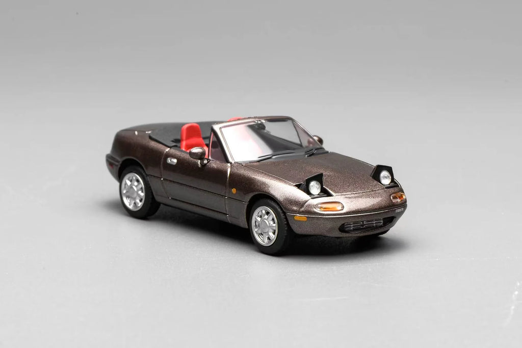 (Coming Soon) MOTORHELIX 1:64 Mazda MX-5 Miata (NA)LHD - Metallic Brown