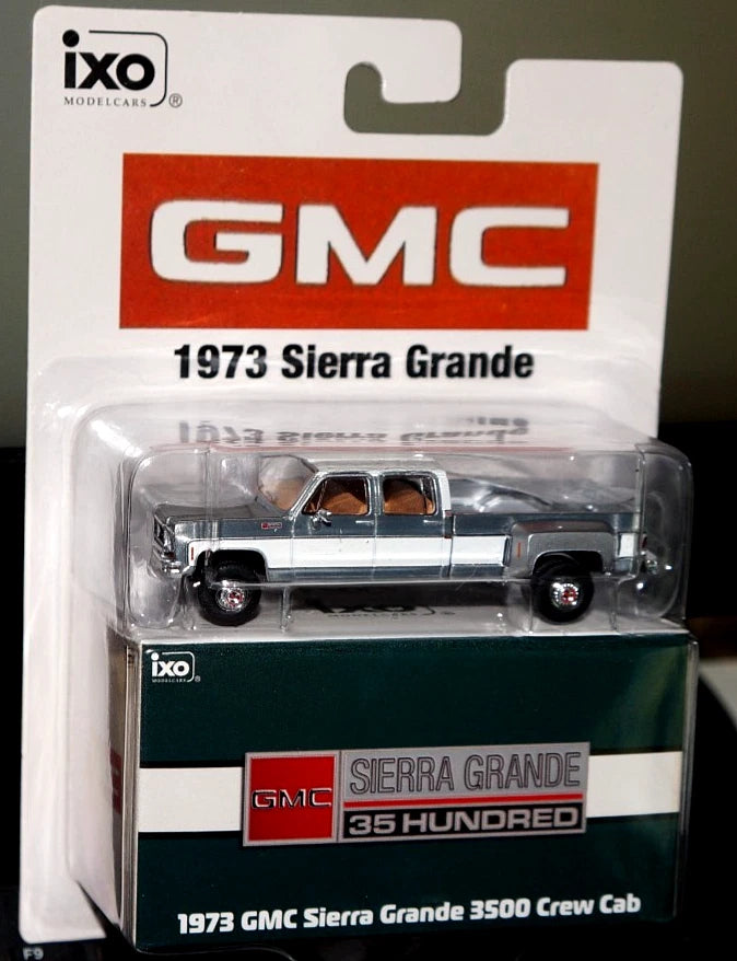 IXO America **Chase Raw (J-hook damage)** 1:64 Scale 1973 GMC Sierra Grande 3500 Crew Cab Dually - Glenwood Green and Frost White