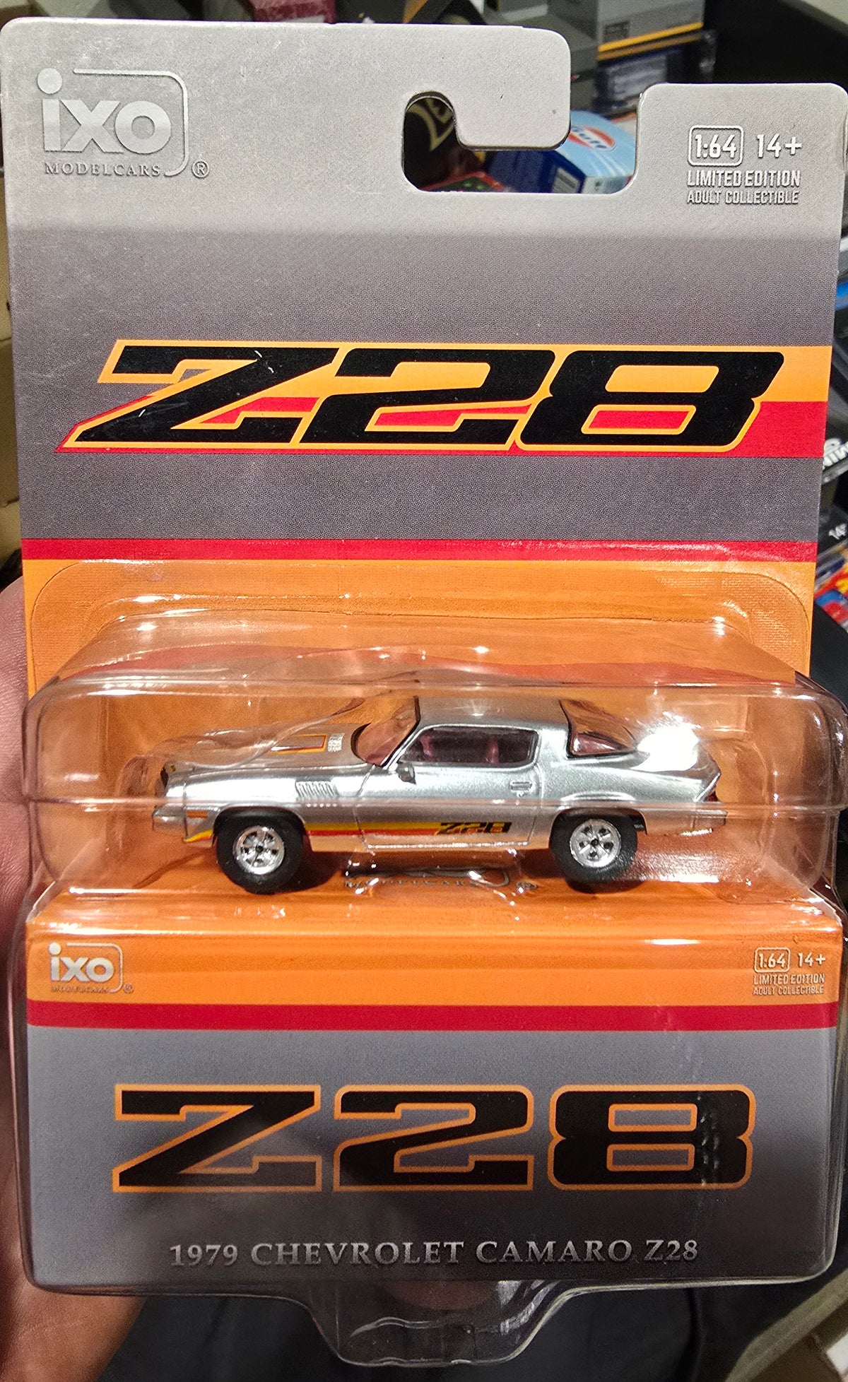 IXOAMERICA 1:64 Scale 1979 Chevrolet Camaro Z28 - Silver with Orange Stripes