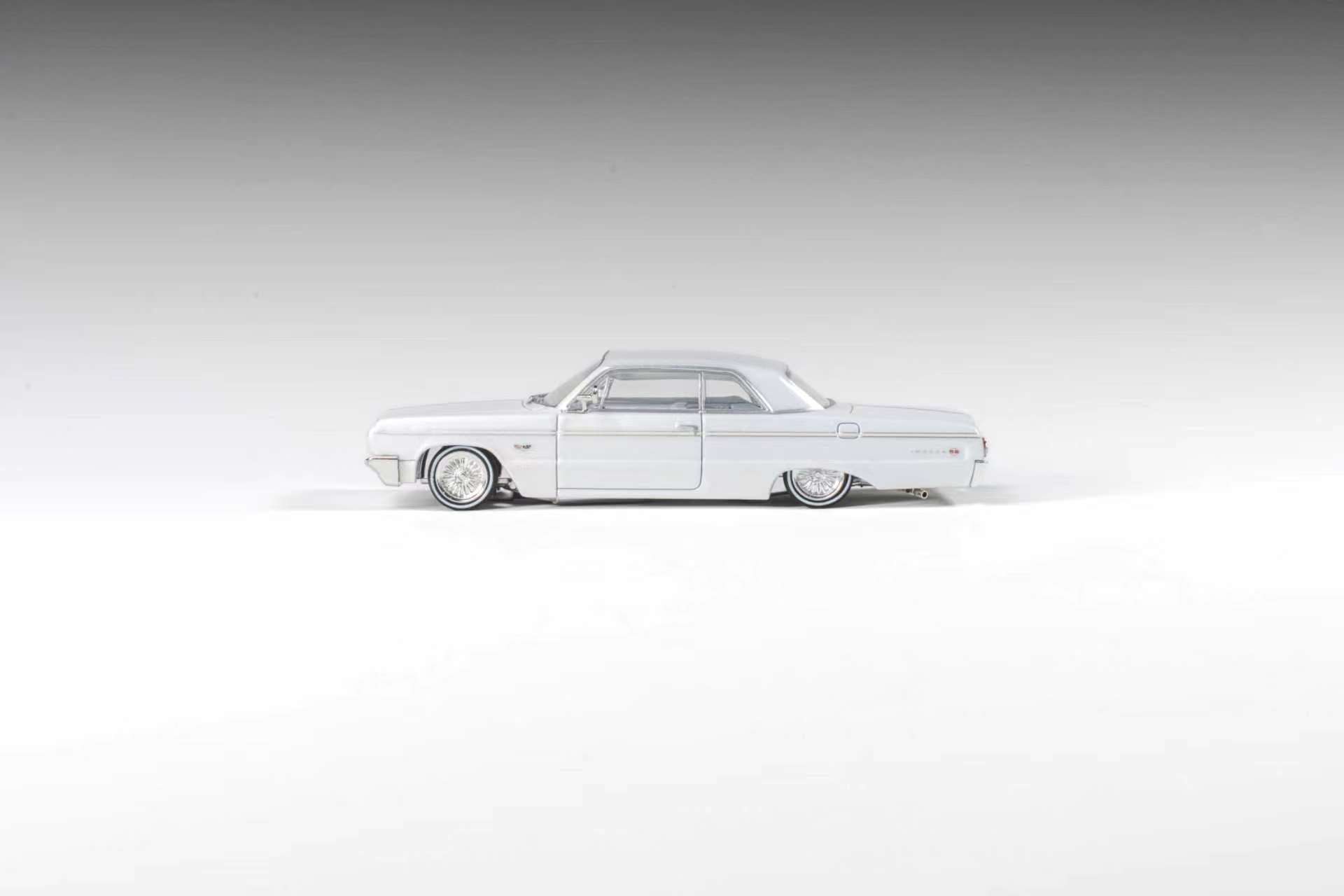 (Coming Soon) 97M 1:64 1964 Chevrolet Impala Low Rider Pearl White