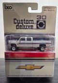 IXO 1:64 1976 Chevrolet Custom Deluxe K30 Fleetside - July 4th Exclusive