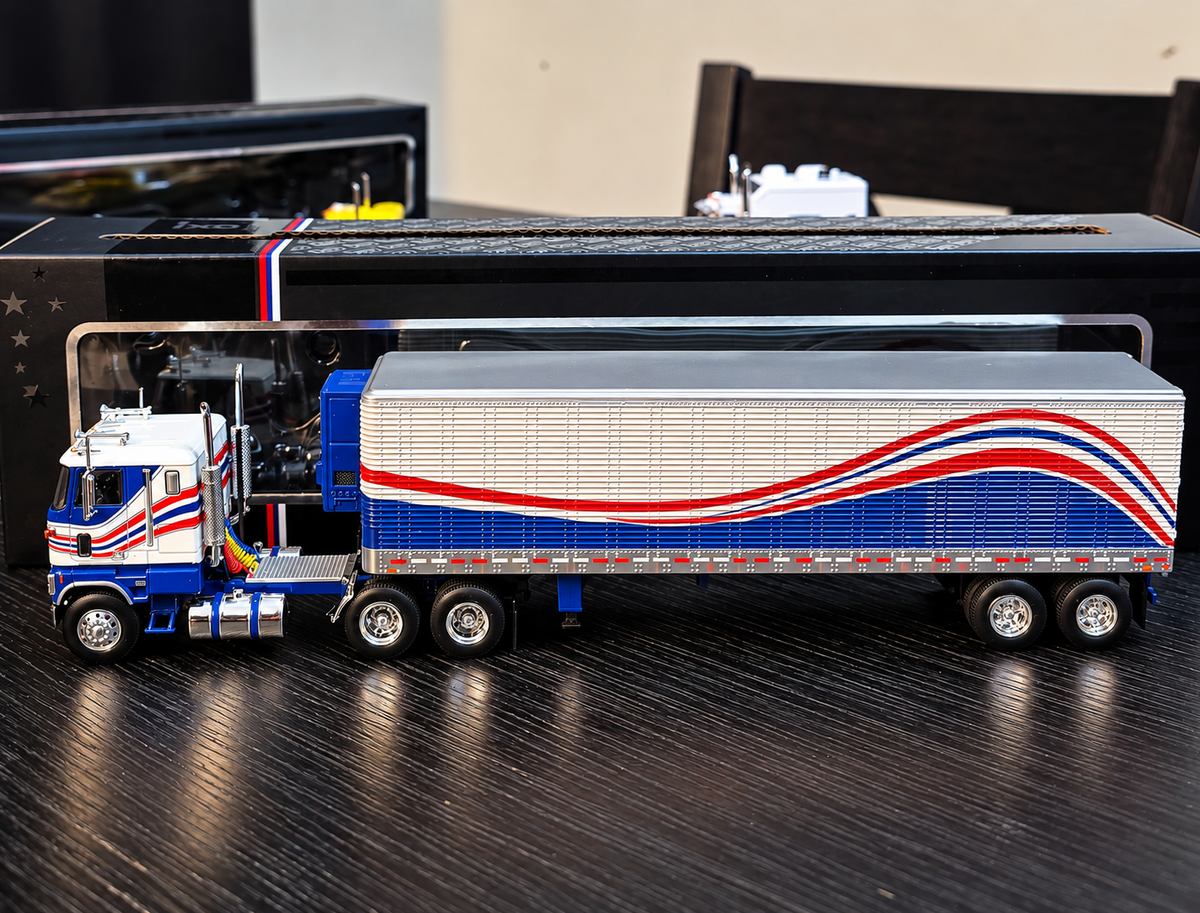 IXOAMERICA 1:64 Scale 1976 Ford CL 9000 Red, White, and Blue with Vintage Trailer
